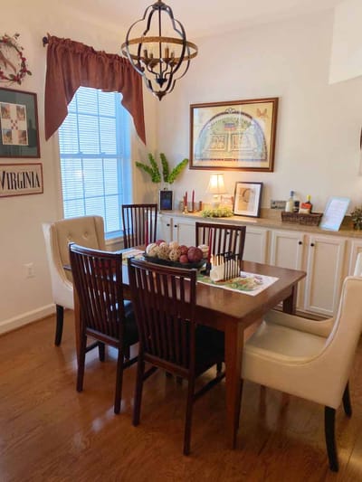 Dining area with a table and chairs in a cozy setting
