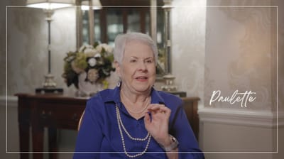 Homestead Hills Assisted Living, Nursing Home in Winston-Salem, NC — Senior resident speaking in a decorated sitting area