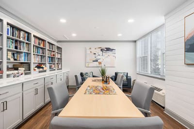 Bright activity room with bookshelves and seating