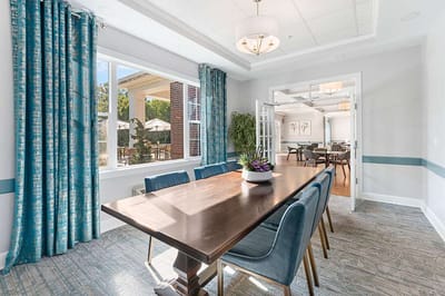 Bright and inviting common area with a dining table