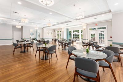 Bright dining area with tables and chairs