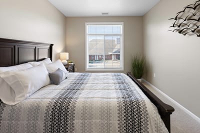 Bright and cozy resident bedroom with a view