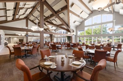 Dining room with tables set for residents