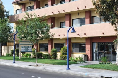 Exterior view of a senior living facility with landscaping