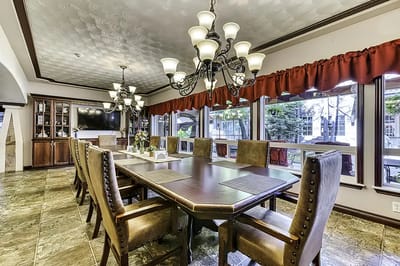 Elegant dining area with wooden table and chairs