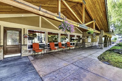 Exterior view of the facility entrance with seating area