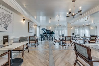 Bright and inviting dining room with piano