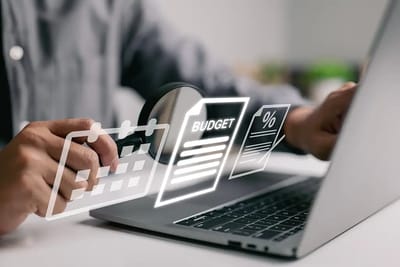 Person working on a laptop with graphic overlays