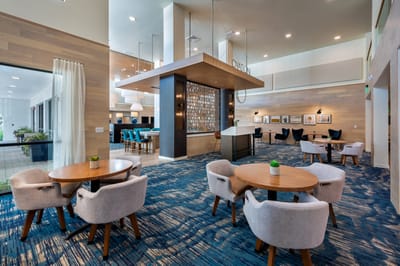 Bright common area with tables and chairs