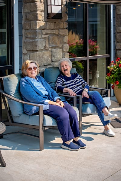 Two residents enjoying time together outside