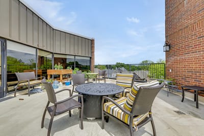 Outdoor seating area with tables and chairs
