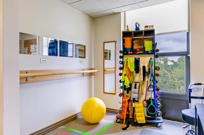 Therapy exercise equipment in a bright room
