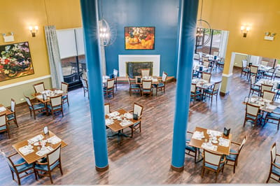 Dining room setup with tables and chairs