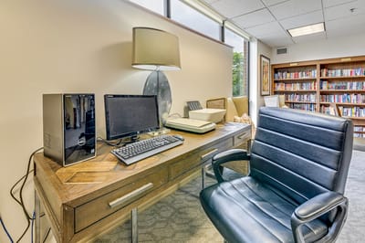 Interior desk area with a computer in a library