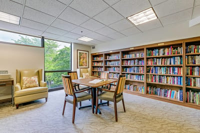 Bright activity room with bookshelves and seating