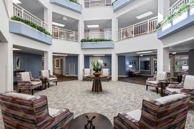 Bright lobby area with seating and greenery