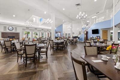 Bright dining area with tables and chairs