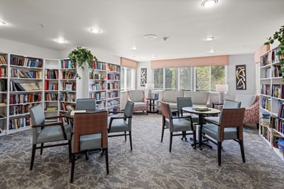 Cozy common area with bookshelves and seating
