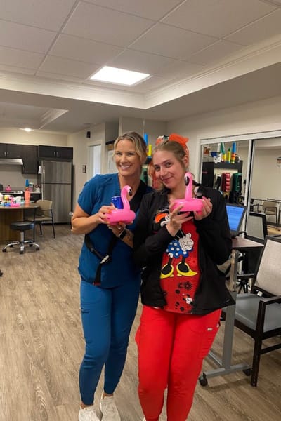 Staff members engaging with fun activities