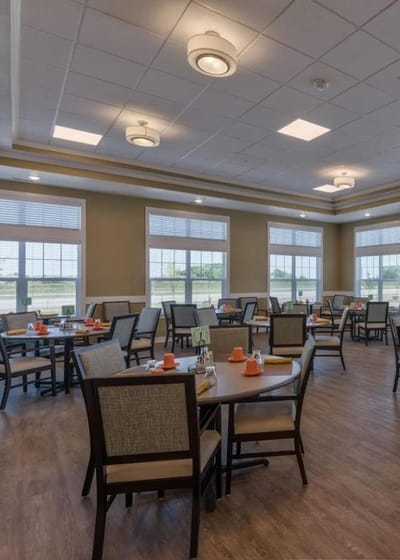 Dining area with round tables and bright windows