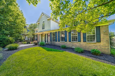 Exterior view of Heritage Villas with lawn and landscaping