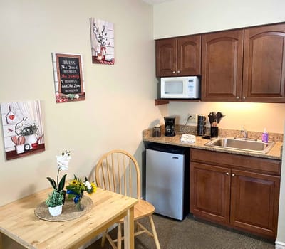 Cozy kitchenette area with a table and chairs