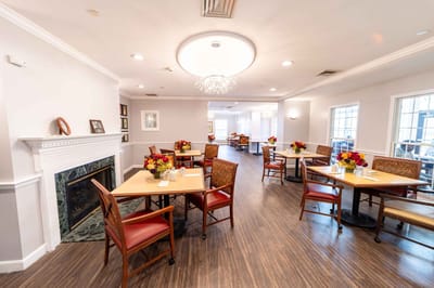 Interior dining area with tables and floral centerpieces