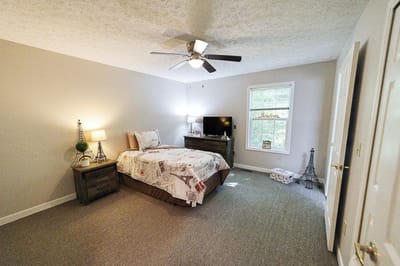 Cozy private room with a bed and TV