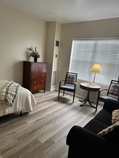 Interior of a private resident room with furniture