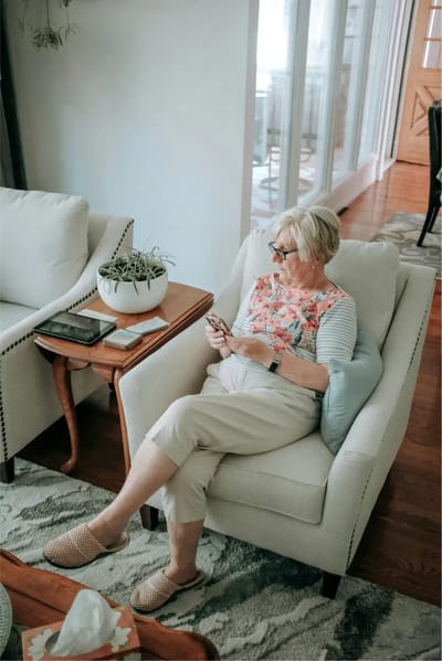 Resident enjoying leisure time in a cozy common area