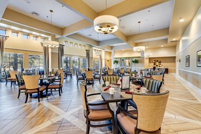 Bright and spacious dining area with tables and chairs