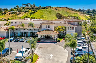 Exterior view of Bonita Villa Senior Living with landscaped gardens
