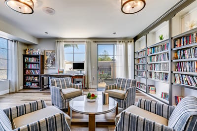 Common area with seating and bookshelves