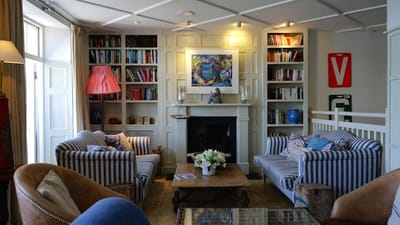 Cozy living area with bookshelves and comfortable seating