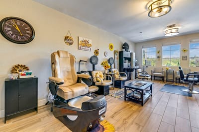 Interior view of a salon area with styling chairs and decor