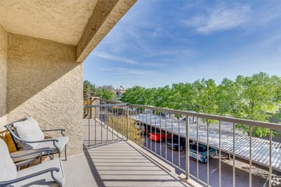 View from a balcony overlooking a parking area