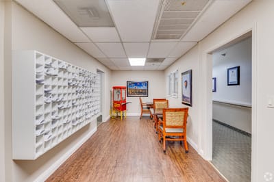 A bright interior hallway with seating and decor