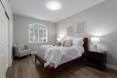 A well-furnished private resident room with a bed
