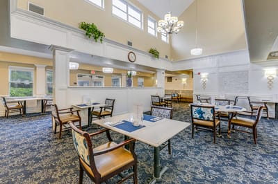 Bright dining area with tables and chairs