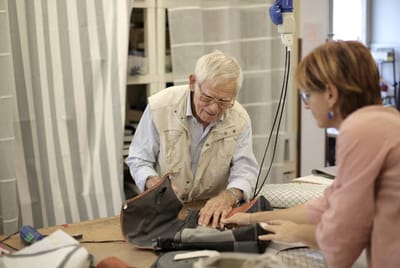 Elderly man and woman engaged in a crafting activity