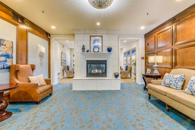 Cozy common area with seating and a fireplace