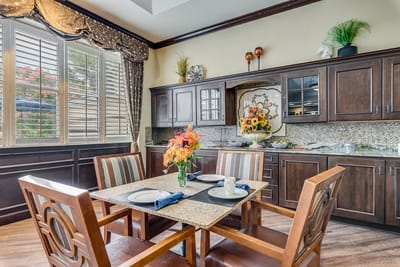 Dining area with flowers and table setting