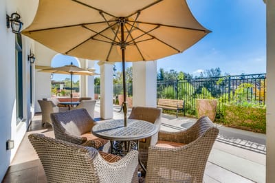 Outdoor patio seating with umbrellas and plants