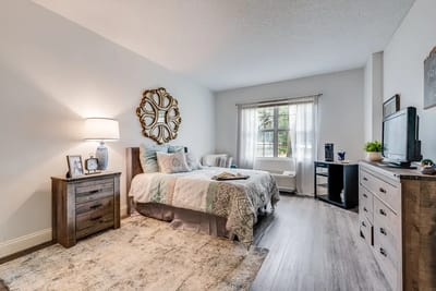 Cozy private resident room with a bed and TV