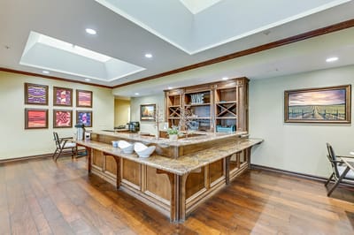 Common area with a wooden counter and art on the walls