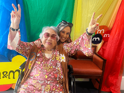 Residents enjoying a fun activity together with peace signs
