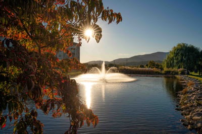 Beautiful outdoor space with a fountain and sunset