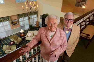Residents smiling in a comfortable common area