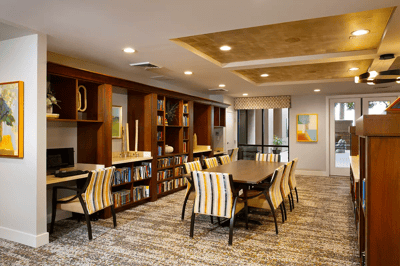 Interior common area with seating and bookshelves