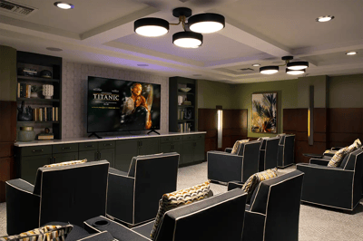 Comfortable movie theater seating in a cozy common area